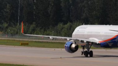 MOSCOW, RUSSIAN FEDERATION - JULY 31, 2021: Airbus A321 Aeroflot taxiing at Sheremetyevo airport, Moscow SVO. Civil aircraft on the taxiway on a summer day. Tourism and travel concept