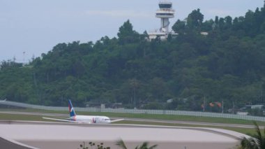 PHUKET, THAILAND - NOVEMBER 28, 2019: Boeing 767 of Azur Air departure at Phuket airport. Airplane set speed and fly away. Travel and tourism concept