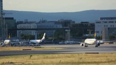 FRANKFURT AM MAIN, GERMANY - JULY 20, 2017: Commercial plane of Lufthansa taxiing after landing at Fraport, Frankfurt, Germany. Tourism and travel concept, air flight