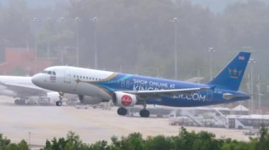 PHUKET, THAILAND - NOVEMBER 28, 2019: Airbus A320 of AirAsia Amazing Thailand Livery landing on the Phuket airport. Tourism and travel concept