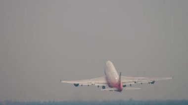 MOSCOW, RUSSIAN FEDERATION - JULY 30, 2021: Rear view Boeing 747 of Rossiya Airlines climb after takeoff at Sheremetyevo Airport SVO. Tourism and travel concept