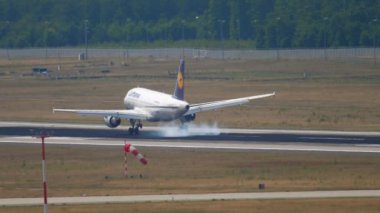 FRANKFURT AM MAIN, GERMANY - JULY 19, 2017: Airbus A319 of Lufthansa descending for landing at Frankfurt Airport. Tourism and travel concept, air flight