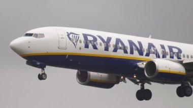 FRANKFURT AM MAIN, GERMANY - JULY 20, 2017: Middle shot of Boeing 737 Ryanair approaching for landing at Fraport, Frankfurt, Germany. Aviation, tourism and travel concept