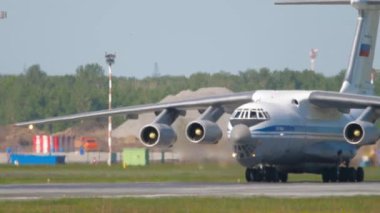 NOVOSIBIRSK, RUSSIAN FEDERATION - JUNY 12, 2022: Transport aircraft IL 76MD taxis to the terminal after landing at Tolmachevo airport. Il-76 Soviet heavy military transport aircraft