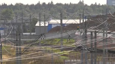 Double-decker commuter trains pass railway station. Modern double decker train rides of Airport.