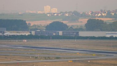 Jet airplane approaching to land, long shot. Tourism and travel concept