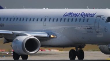 FRANKFURT AM MAIN, GERMANY - JULY 18, 2017: Embraer E190, D-AECF of Lufthansa CityLine taxiing at Frankfurt Airport, Germany. Tourism and travel concept