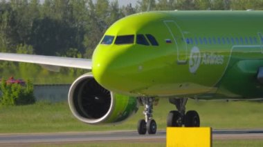 NOVOSIBIRSK, RUSSIAN FEDERATION - JUNY 12, 2022: Close-up shot of a passenger Airbus S7 Airlines on the taxiway at Tomachevo Airport, Novosibirsk. Tourism and aviation concept