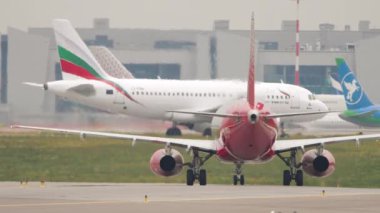 MOSCOW, RUSSIAN FEDERATION - JULY 28, 2021: Sukhoi Superjet 100 of Rossiya rides on the runway for departure at Sheremetyevo Airport SVO. Airplane on the runway, summer day