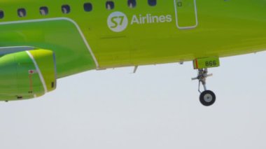 NOVOSIBIRSK, RUSSIAN FEDERATION - JUNY 12, 2022: Passenger jet plane Embraer E170 of S7 Airlines landing at Tomachevo Airport, Novosibirsk. Tourism and aviation concept