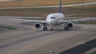 FRANKFURT AM MAIN, GERMANY - JULY 19, 2017: Middle shot of Airbus A320 Air Astana taxiing on the airfield at Frankfurt Airport, Germany. Tourism and travel concept, air flight