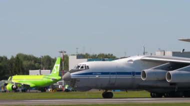 NOVOSIBIRSK, RUSSIAN FEDERATION - JUNY 12, 2022: Heavy transport aircraft of IL 76 taxiing at Tolmachevo airport. Il-76 Soviet military transport aircraft