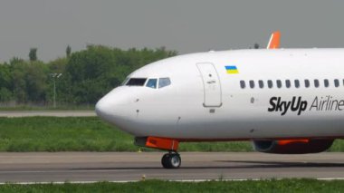 ALMATY, KAZAKHSTAN - MAY 4, 2019: Side view of Boeing 737 SkyUp Airlines ton runway at Almaty airport, Kazakhstan. SkyUp Airlines is a private Ukrainian airline. Tourism and travel concept