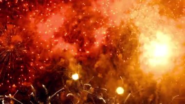 Beautiful festive fireworks in the night sky over the city. Holiday concept. Bright lights in honor of the holiday