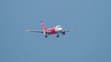 PHUKET, THAILAND - DECEMBER 02, 2018: Airbus A320 of Air Asia approaching before landing at Phuket airport HKT. Traffic at Phuket Airport