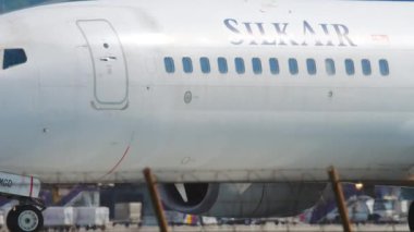 PHUKET, THAILAND - DECEMBER 02, 2018: Boeing 737 of SilkAir taxis for departure. Tourism and travel concept