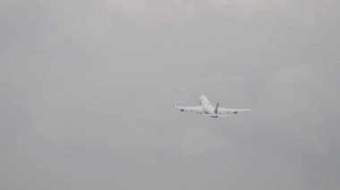 FRANKFURT AM MAIN, GERMANY - JULY 20, 2017: Long shot, passenger plane of Lufthansa fly away, climbing at Frankfurt Airport, Germany FRA. Tourism and travel concept