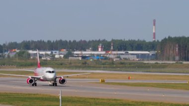 MOSCOW, RUSSIAN FEDERATION - JULY 31, 2021: Airplane Sukhoi Superjet 100 of Rossiya rides at Sheremetyevo Airport SVO. Tourism and travel concept