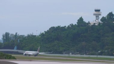 PHUKET, THAILAND - NOVEMBER 28, 2019: Airplane of Qatar Airways taxiing on the runway at Phuket airport. Tourism and travel concept, air flight