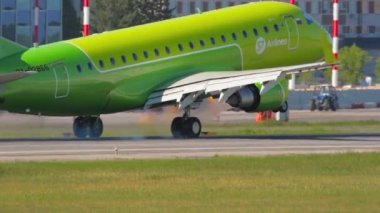 NOVOSIBIRSK, RUSSIAN FEDERATION - JUNY 12, 2022: S7 Airlines flight arrival at the airport, landing and braking. Tourism and aviation concept