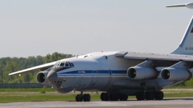 NOVOSIBIRSK, RUSSIAN FEDERATION - JUNY 12, 2022: Transport aircraft IL 76 taxiing at Tolmachevo airport. Il-76 Soviet heavy military transport aircraft