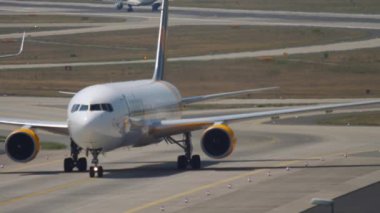 FRANKFURT AM MAIN, GERMANY - JULY 19, 2017: Passenger plane Boeing 767 of Condor taxiing after landing at Frankfurt airport Germany. Tourism and aviation concept