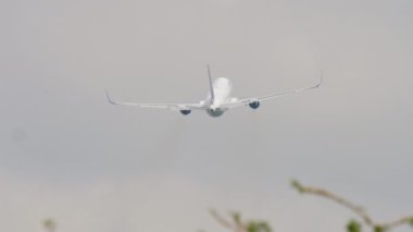 Long shot rear view of aircraft fly away, departure. Tourism and travel concept, air flight.