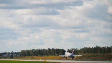 MOSCOW, RUSSIAN FEDERATION - SEPTEMBER 12, 2020: Rear view, Sukhoi SuperJet 100 of Aeroflot airline landing at Sheremetyevo airport. Tourism and aviation concept