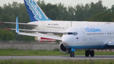 NOVOSIBIRSK, RUSSIAN FEDERATION - JULY 15, 2022: Boeing 737, RA-73229 of Pobeda Airlines taxiing at Tolmachevo airport.