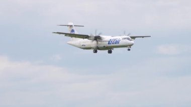 NOVOSIBIRSK, RUSSIAN FEDERATION - JULY 15, 2022: ATR-72, RA-67686 of UTair landing. Turboprop passenger plane approaching at Tolmachevo airport