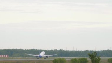 NOVOSIBIRSK, RUSSIAN FEDERATION - JULY 15, 2022: Airbus A321neo of Ural Airlines takeoff at Tolmachevo Airport, Novosibirsk. Airplane departure, rear view