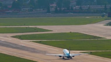 SOCHI, RUSSIA - JULY 30, 2022: Rear view of Boeing 737 Nordstar Airlines taking off at Sochi International Airport. Tourism and travel concept. NordStar Airlines Russian airline