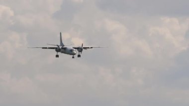 NOVOSIBIRSK, RUSSIAN FEDERATION - JULY 15, 2022: Soviet military transport aircraft Antonov An-26 approaching before landing at Tolmachevo airport