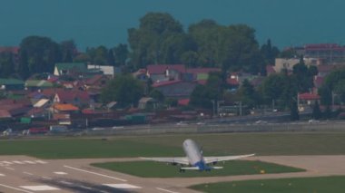 SOCHI, RUSSIA - JULY 31, 2022: Rear view of Boeing 777 Aeroflot takeoff at Sochi International Airport. Aviation traffic. Tourism and travel concept