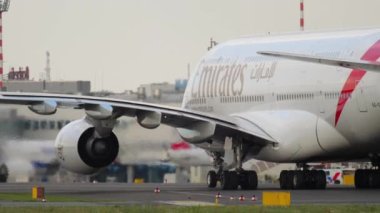 DUSSELDORF, GERMANY - JULY 23, 2017: Airbus A380 of Emirates Airlines taxiing at Dusseldorf airport. Widebody jet passenger aircraft. Cinematic shot of an airplane on the runway