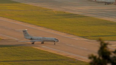 SOCHI, RUSSIA - JULY 28, 2022: Long shot of aircraft TU-134 Special Flight Detachment Russia taxiing on the runway at Sochi airport.