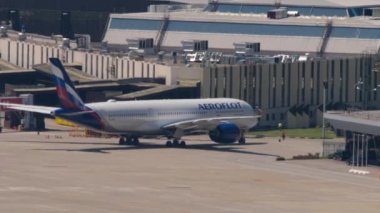 SOCHI, RUSSIA - JULY 28, 2022: Airbus A320 Aeroflot arrived at Sochi airport and is taxiing to the terminal. Tourism and travel concept