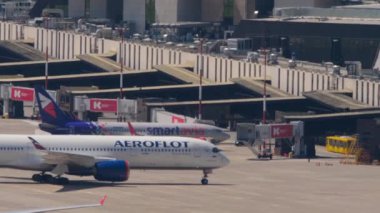 SOCHI, RUSSIA - JULY 28, 2022: Commercial passenger aircraft Airbus A350 of Aeroflot arrived at Sochi airport and is taxiing to the terminal. Tourism and travel concept