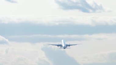 Jet unrecognizable plane takeoff and climb in cloudy sky, view from the back long shot. Tourism and travel concept