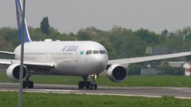ALMATY, KAZAKHSTAN - MAY 4, 2019: Boeing 767 of Air Astana take off, departure at Almaty airport, Kazakhstan. Twin-engine widebody airliner