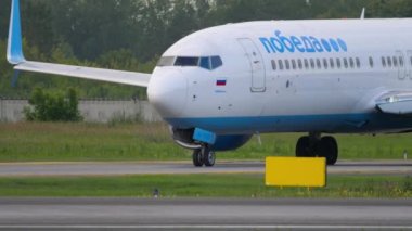 NOVOSIBIRSK, RUSSIAN FEDERATION - JULY 15, 2022: Boeing 737, RA-73229 of Pobeda Airlines taxiing at Tolmachevo airport. Low-cost airliner on the taxiway. Tourism and travel concept