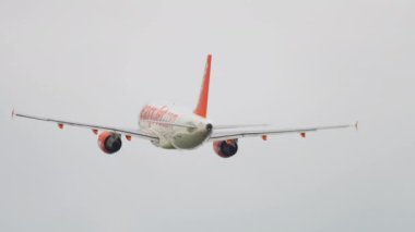 AMSTERDAM, THE NETHERLANDS - JULY 26, 2017: Airbus A320 of EasyJet departure at Schiphol Airport, Amsterdam. Departing plane, rear view. Tourism and travel concept
