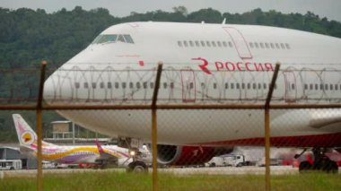 PHUKET, THAILAND - NOVEMBER 26, 2017: Boeing 747 of Rossiya taxiing on the runway before departure at Phuket airport. Tourism and travel concept