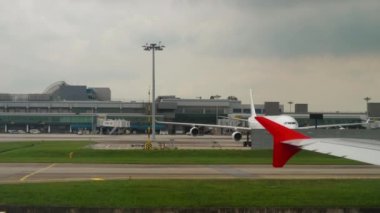CHANGI, SINGAPORE - NOVEMBER 25, 2018: Passenger plane is ready to take off, first person view. Runway, Singapore Airport. Tourism and aviation concept