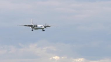 NOVOSIBIRSK, RUSSIAN FEDERATION - JULY 15, 2022: Airplane Antonov An-26 approaching before landing at Tolmachevo airport. Soviet military transport aircraft