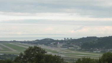 Timelapse of airport traffic. General panoramic view of the airfield. Clouds float over the city
