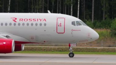 MOSCOW, RUSSIAN FEDERATION - JULY 28, 2021: Sukhoi Superjet 100-95B, RA-89014 of Rossiya taxiing at Sheremetyevo Airport SVO. Tourism and travel concept. Airplane on the taxiway