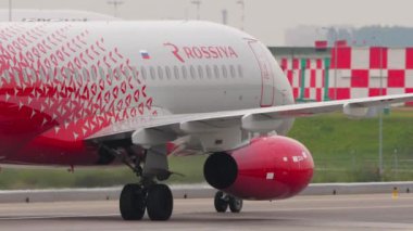 MOSCOW, RUSSIAN FEDERATION - JULY 28, 2021: Airplane of Rossiya taxiing after landing at Sheremetyevo Airport SVO. Tourism and travel concept. Airplane on the taxiway