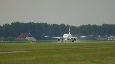 AMSTERDAM, THE NETHERLANDS - JULY 24, 2017: Passenger Airbus A320 of Finnair speed up before takeoff at Amsterdam Airport. Tourism and travel concept
