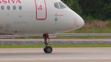 MOSCOW, RUSSIAN FEDERATION - JULY 28, 2021: Passenger airplane of Rossiya taxiing at Sheremetyevo Airport SVO. Tourism and travel concept. Aircraft on the taxiway, side view